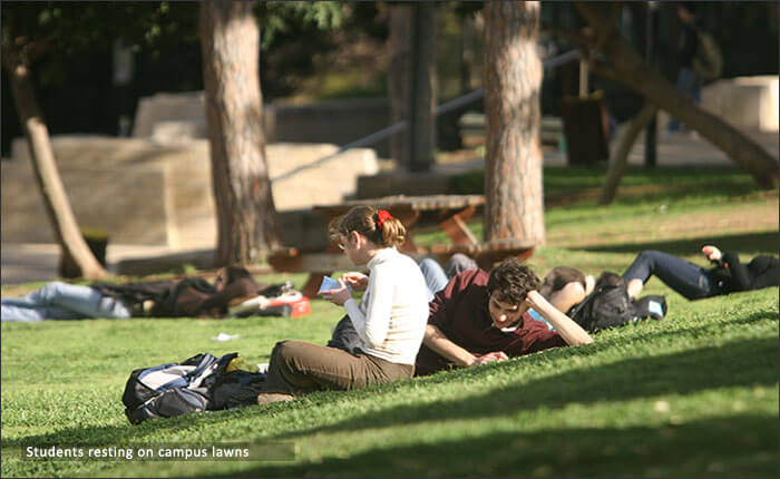 Students resting on campus lawns